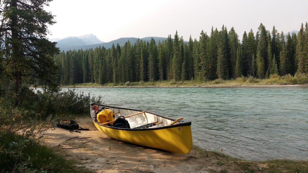 A canoe is wider and more open than a kayak.